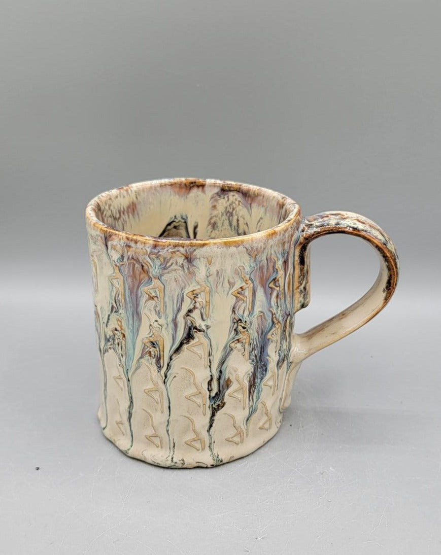 Embossed Dancer Ceramic Mug in Melting Cream