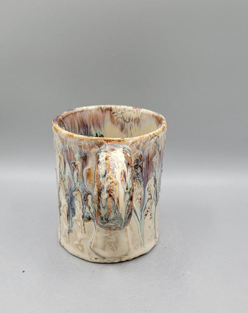 Embossed Dancer Ceramic Mug in Melting Cream