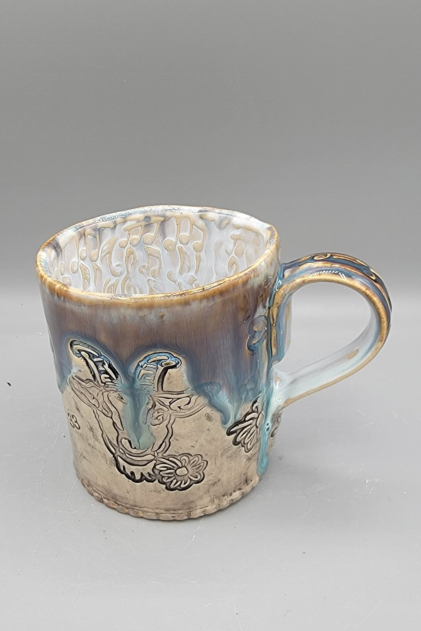 14-15oz Embossed BMFS Happy Goat Ceramic Mug in Touch of Gray With Music Notes on the Inside