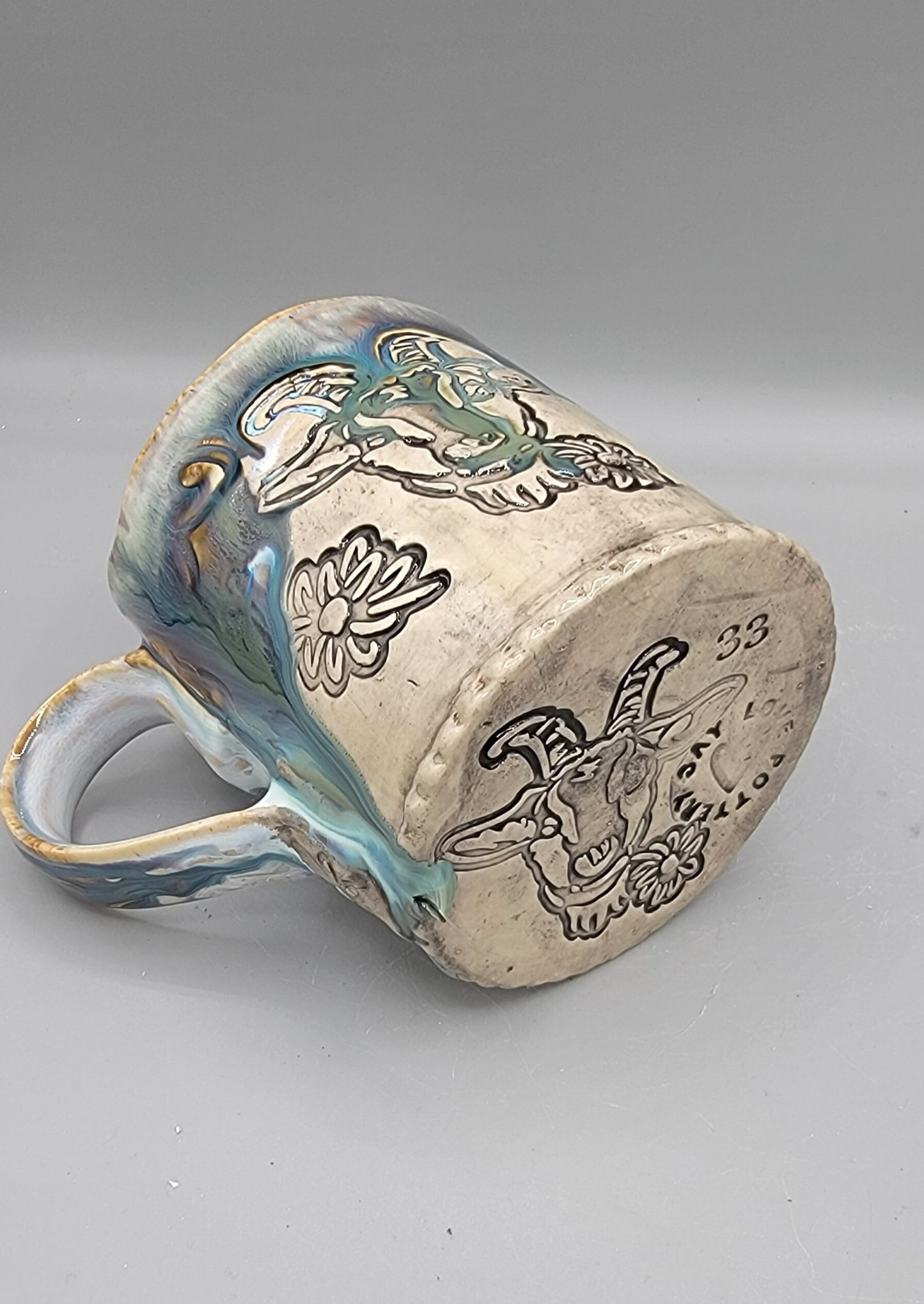 14-15oz Embossed BMFS Happy Goat Ceramic Mug in Touch of Gray With Music Notes on the Inside