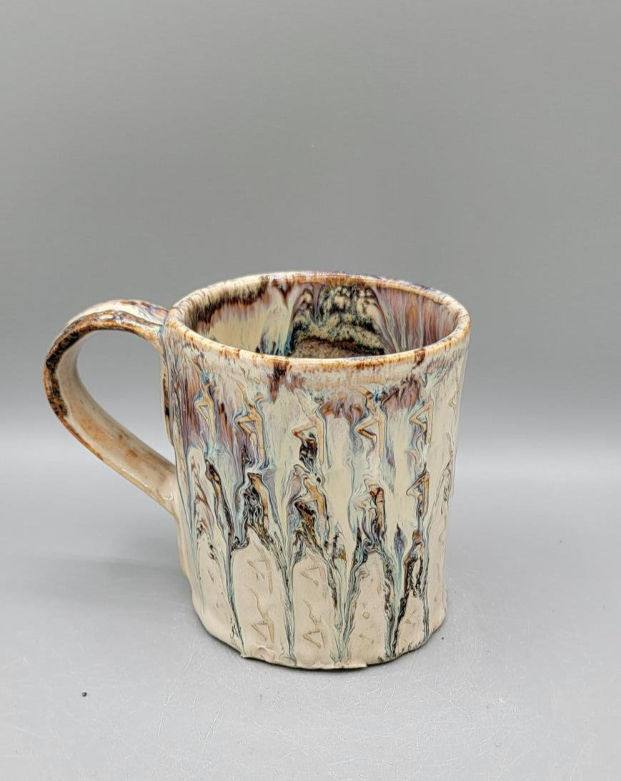 Embossed Dancer Ceramic Mug in Melting Cream