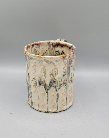 Embossed Dancer Ceramic Mug in Melting Cream
