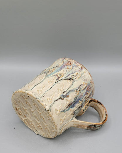Embossed Dancer Ceramic Mug in Melting Cream