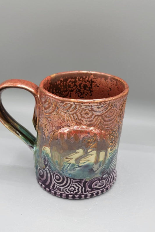14-15 oz Embossed Trippy Circles Mug with Bolt Medallion in Melting Copper to Purple