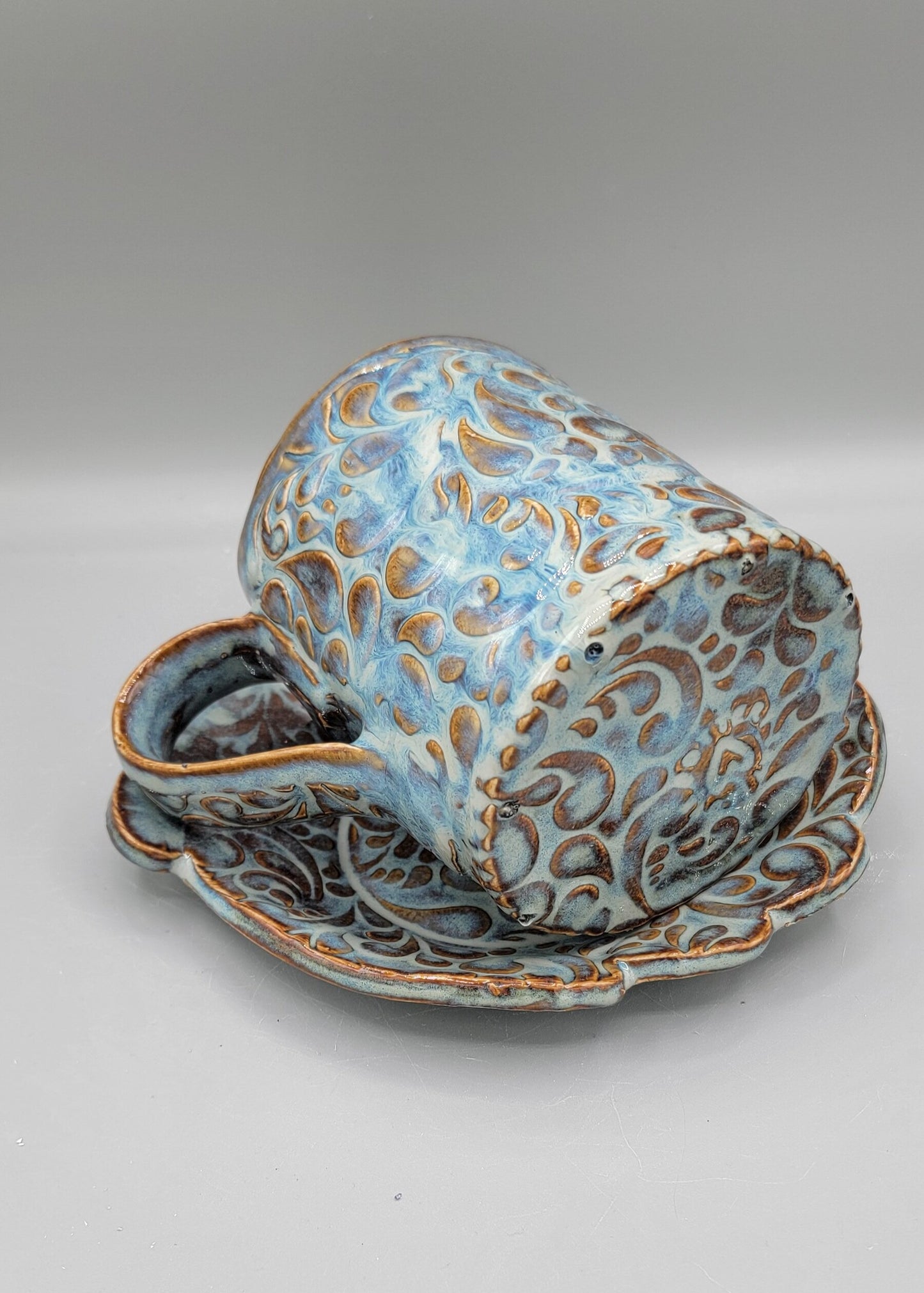 Embossed Paisley Ceramic Mug with Matching Fancy Saucer in Floating Blue