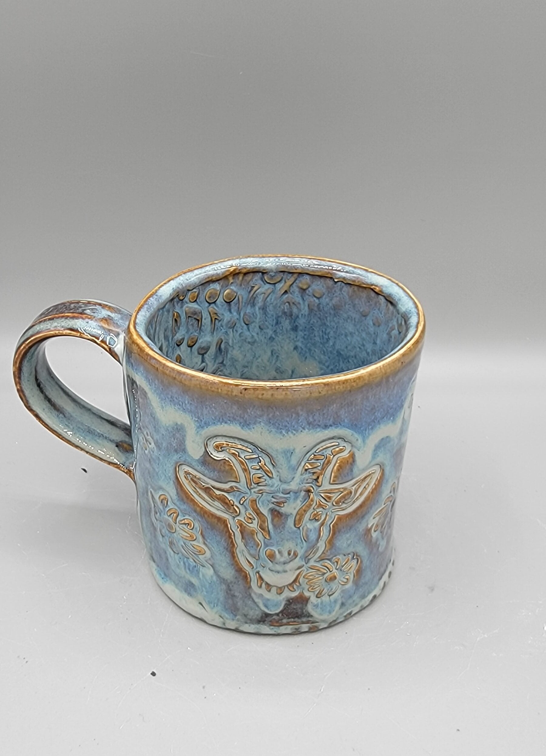 14-15oz Embossed BMFS Happy Goat Ceramic Mug in Floating Blue With Music Notes on Inside